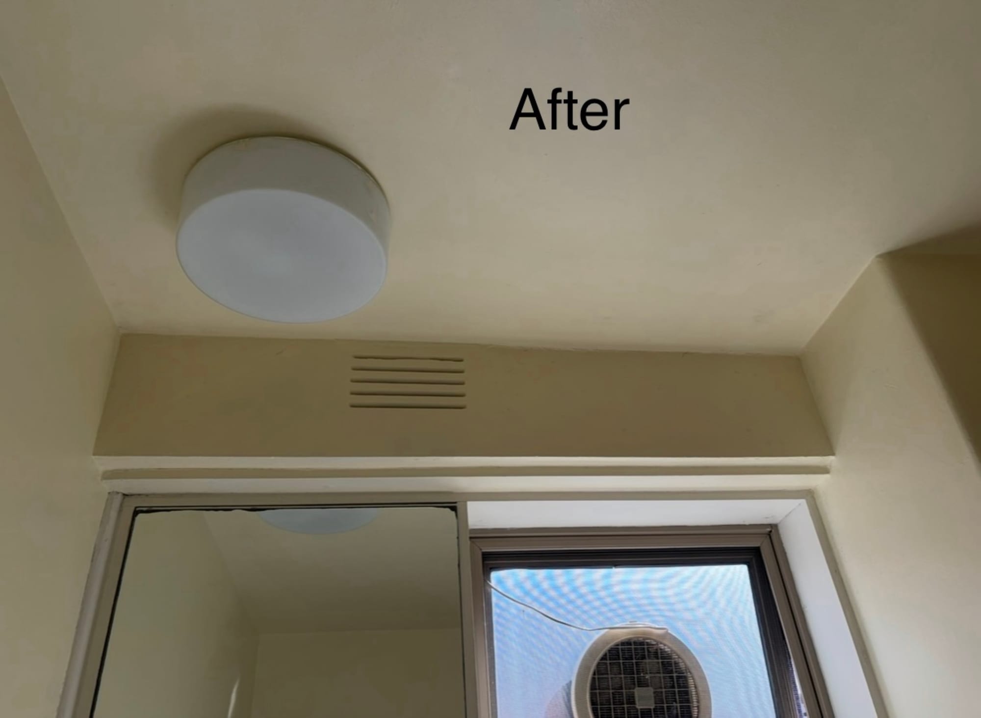 Clean ceiling with new light fitting after